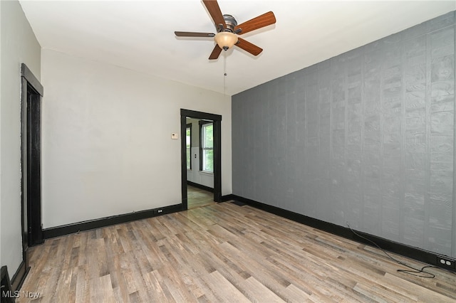 3620 E 63rd St, Cleveland, OH 44105 - empty room with wood finished floors and ceiling fan