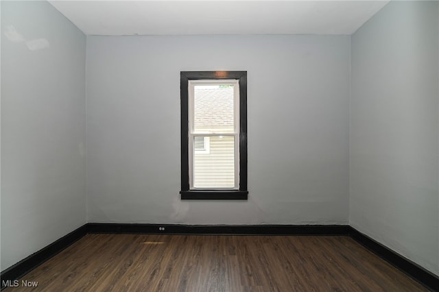 3620 E 63rd St, Cleveland, OH 44105 - empty room featuring dark wood finished floors and baseboards