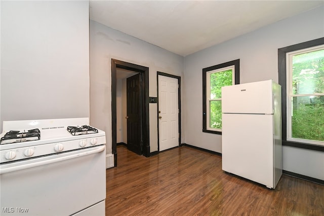 3620 E 63rd St, Cleveland, OH 44105 - kitchen featuring white appliances, healthy amount of natural light, and dark wood finished floors