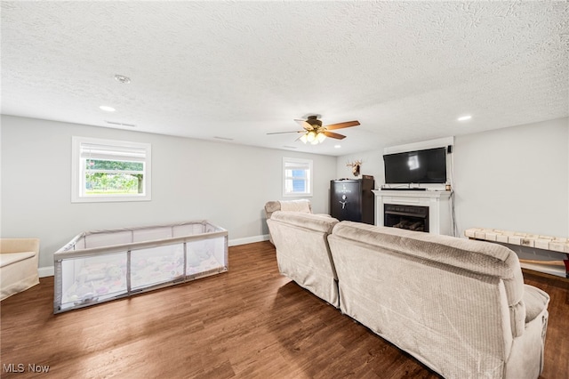 350 Townline Rd, Aurora, OH 44202 - living room with a textured ceiling, a fireplace, wood finished floors, recessed lighting, and ceiling fan