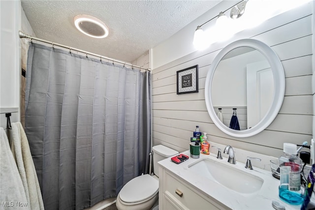 350 Townline Rd, Aurora, OH 44202 - bathroom featuring a textured ceiling, vanity, wood walls, and a shower with curtain