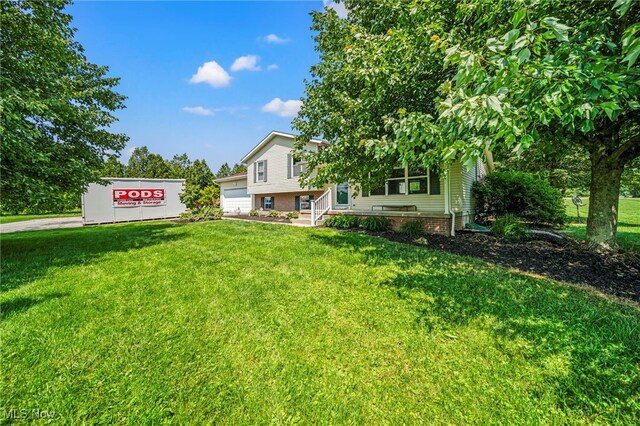 350 Townline Rd, Aurora, OH 44202 - view of front facade with a front lawn and a garage