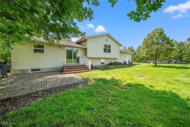 350 Townline Rd, Aurora, OH 44202 - back of property featuring a lawn and a patio