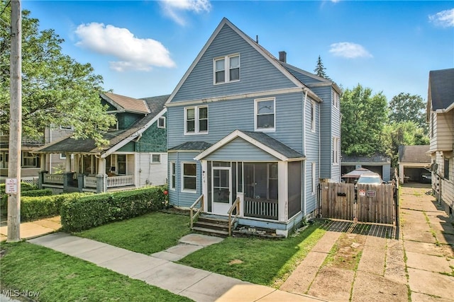 3676 E 69th St, Cleveland, OH 44105 - view of front of home with a sunroom and a chimney