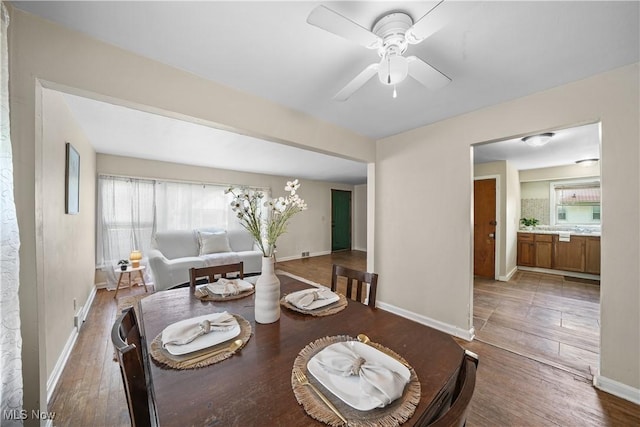 1369 Adelaide Ave SE, Warren, OH 44484 - dining room with healthy amount of natural light, a ceiling fan, and wood finished floors