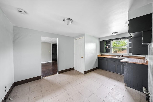 1369 Adelaide Ave SE, Warren, OH 44484 - kitchen with wooden counters and open shelves
