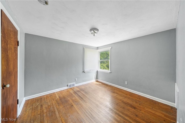 1369 Adelaide Ave SE, Warren, OH 44484 - spare room with baseboards and hardwood / wood-style floors