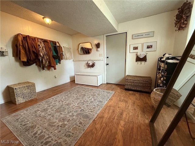 14003 N Highview Dr, Dalton, OH 44618 - foyer entrance featuring a textured ceiling and wood finished floors