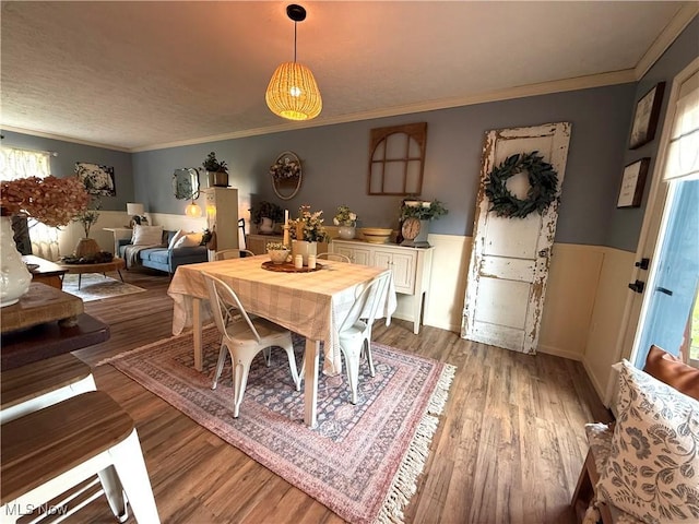 14003 N Highview Dr, Dalton, OH 44618 - dining area featuring wood finished floors, wainscoting, and ornamental molding