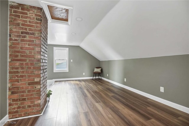4328 W 56th St, Cleveland, OH 44144 - additional living space featuring dark wood-style floors, lofted ceiling, and attic access