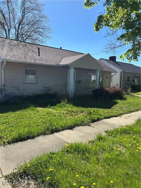 925 Ohio Ave, Mcdonald, OH 44437 - view of side of property featuring a lawn and roof with shingles