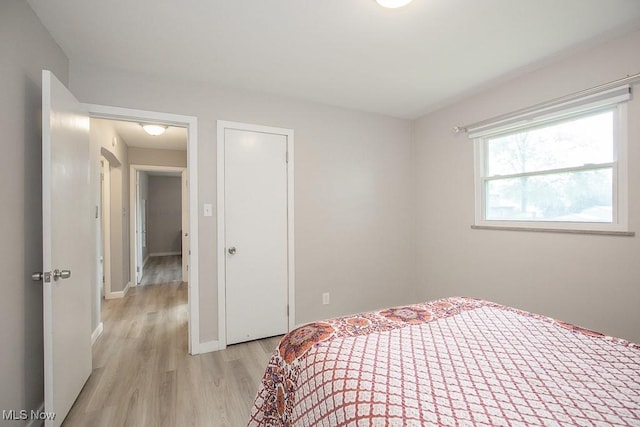 2611 E Pleasant Valley Rd, Seven Hills, OH 44131 - bedroom with light wood-type flooring and a closet