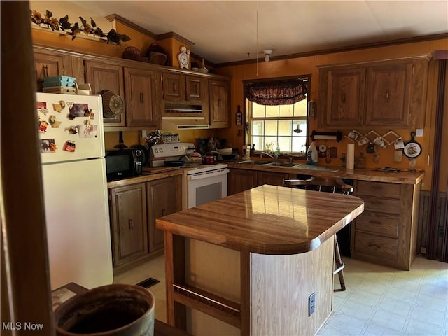 3 Concert Ln, Olmsted Twp, OH 44138 - kitchen featuring white appliances, wood counters, crown molding, a kitchen island, and light flooring