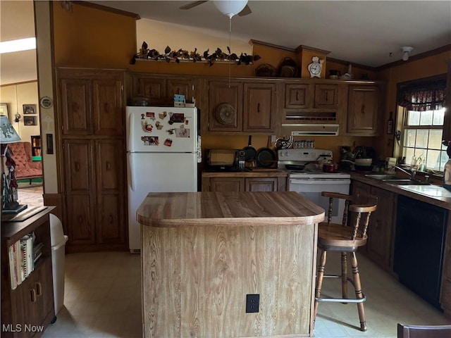 3 Concert Ln, Olmsted Twp, OH 44138 - kitchen featuring white appliances, vaulted ceiling, range hood, ceiling fan, and a kitchen island
