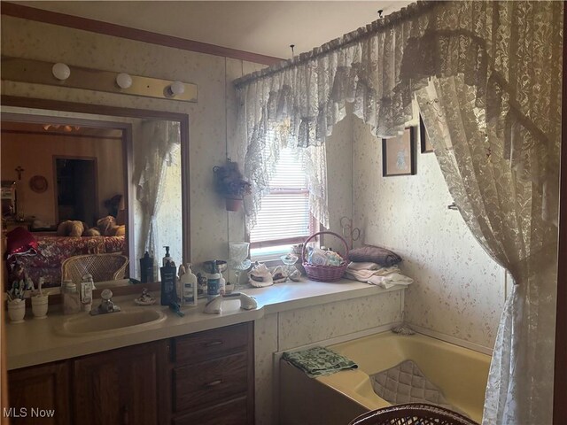 3 Concert Ln, Olmsted Twp, OH 44138 - bathroom featuring a bath, wallpapered walls, and vanity
