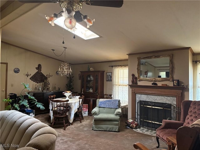 3 Concert Ln, Olmsted Twp, OH 44138 - carpeted living area featuring crown molding, vaulted ceiling, a skylight, a fireplace, and a chandelier