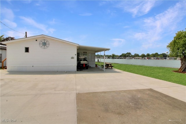 1660 N Compass Ave, Port Clinton, OH 43452 - view of property exterior with a lawn and a carport