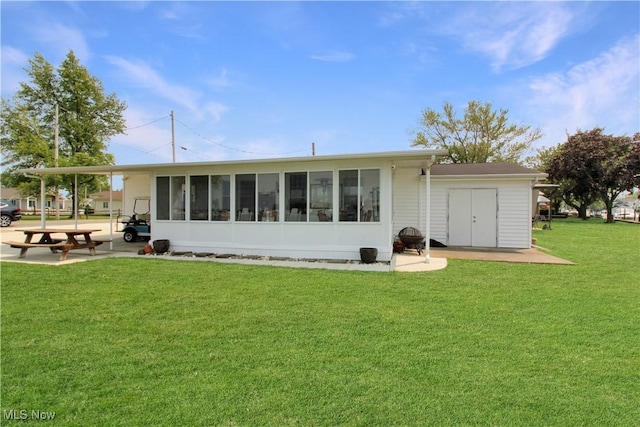 1660 N Compass Ave, Port Clinton, OH 43452 - back of house featuring a yard and a sunroom