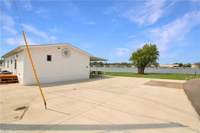1660 N Compass Ave, Port Clinton, OH 43452 - view of side of home with a patio area