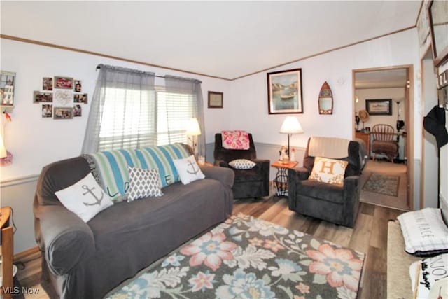 1660 N Compass Ave, Port Clinton, OH 43452 - living area with vaulted ceiling, wood finished floors, and crown molding