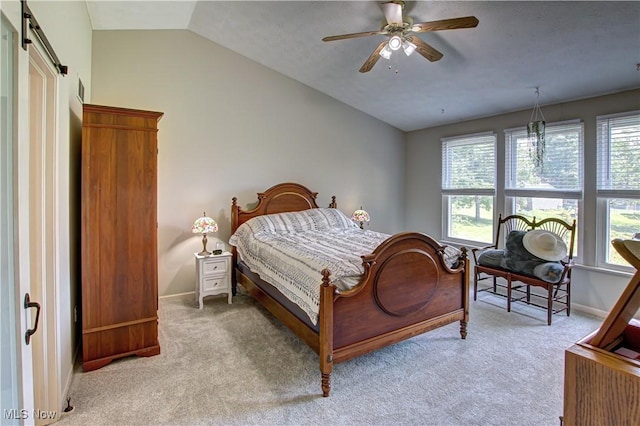 881 Brightwood Ct, Brunswick, OH 44212 - bedroom with a barn door, light carpet, vaulted ceiling, and ceiling fan