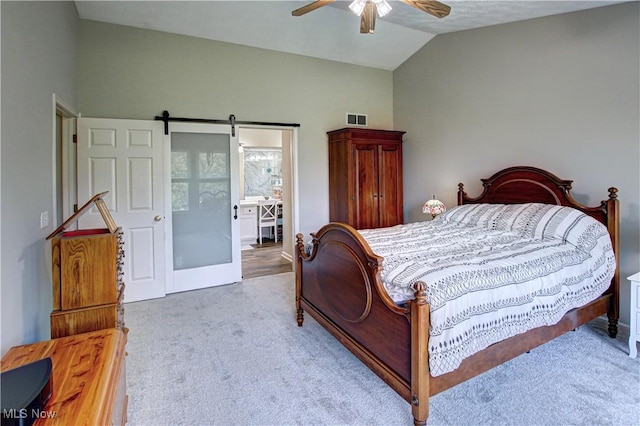 881 Brightwood Ct, Brunswick, OH 44212 - carpeted bedroom featuring vaulted ceiling, ceiling fan, a barn door, and ensuite bath