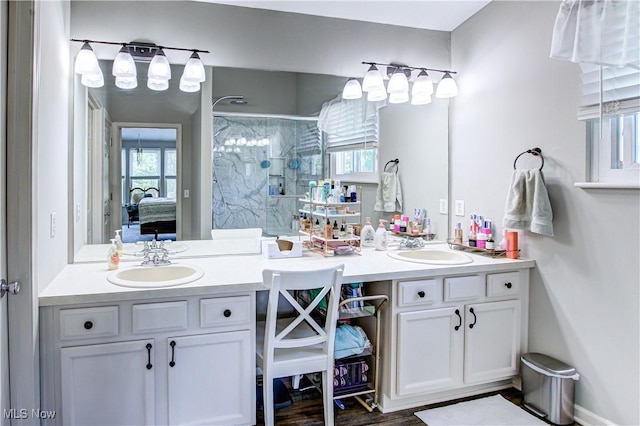 881 Brightwood Ct, Brunswick, OH 44212 - ensuite bathroom featuring double vanity, a stall shower, and healthy amount of natural light