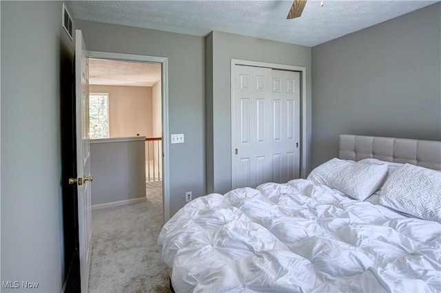 881 Brightwood Ct, Brunswick, OH 44212 - bedroom with carpet floors, a textured ceiling, a closet, and ceiling fan