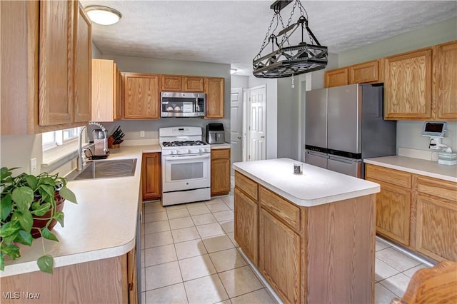 881 Brightwood Ct, Brunswick, OH 44212 - kitchen with stainless steel appliances, a kitchen island, light countertops, light tile patterned floors, and a textured ceiling