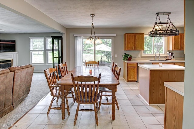 881 Brightwood Ct, Brunswick, OH 44212 - dining room with light tile patterned floors, a glass covered fireplace, and a textured ceiling