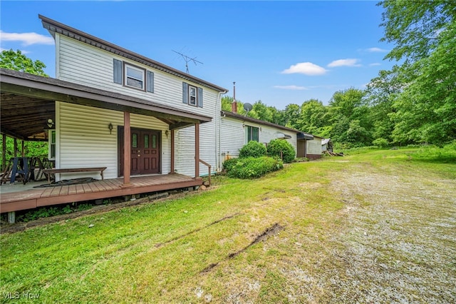 5769 Hurlburt Rd, Rome, OH 44085 - back of house featuring a yard and french doors