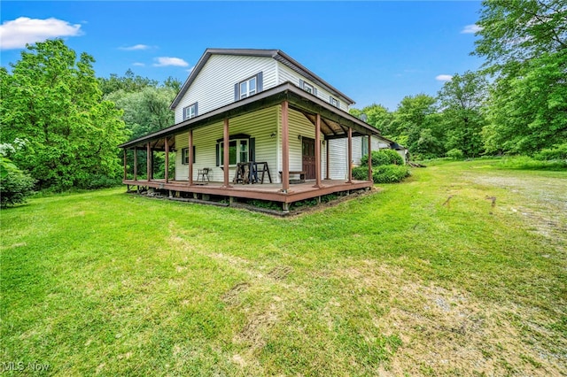 5769 Hurlburt Rd, Rome, OH 44085 - rear view of house featuring a lawn and a wooden deck