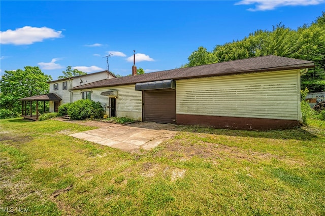 5769 Hurlburt Rd, Rome, OH 44085 - rear view of house with a gazebo, a lawn, and a patio