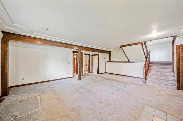 5769 Hurlburt Rd, Rome, OH 44085 - unfurnished living room featuring carpet floors and stairway