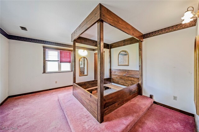 5769 Hurlburt Rd, Rome, OH 44085 - unfurnished bedroom with carpet flooring and beamed ceiling