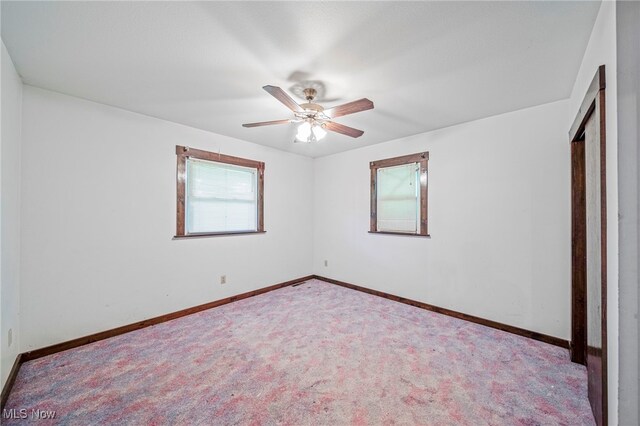 5769 Hurlburt Rd, Rome, OH 44085 - unfurnished bedroom with carpet and ceiling fan