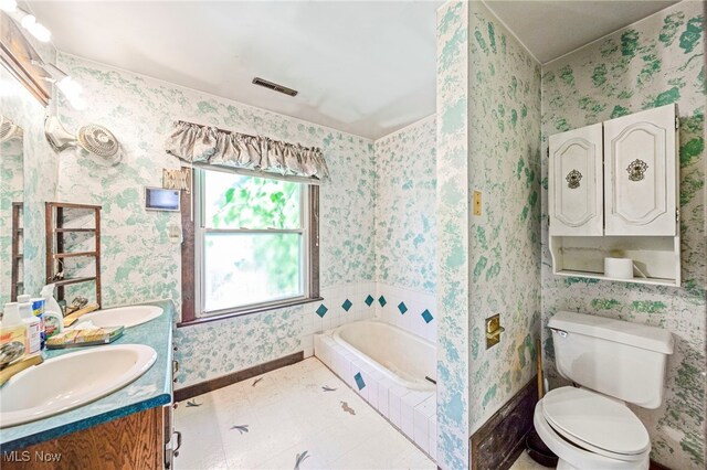 5769 Hurlburt Rd, Rome, OH 44085 - full bathroom with a bath, double vanity, and wallpapered walls