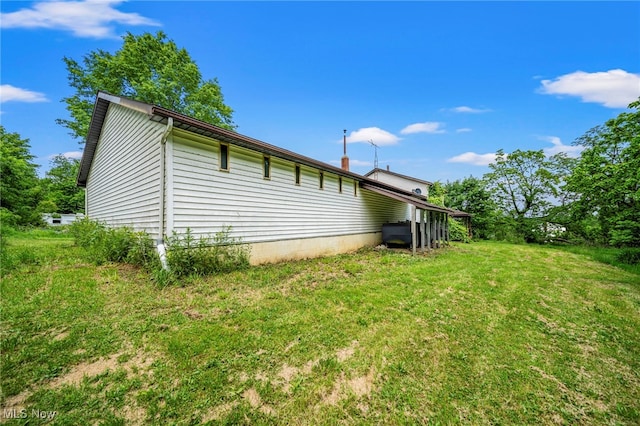 5769 Hurlburt Rd, Rome, OH 44085 - view of home's exterior with a yard