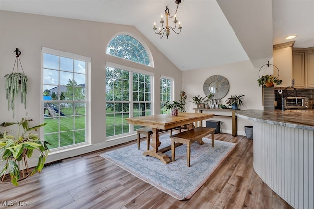 4532 Ridgestone Way, Medina, OH 44256 - dining area with a chandelier, light wood-style floors, high vaulted ceiling, and recessed lighting