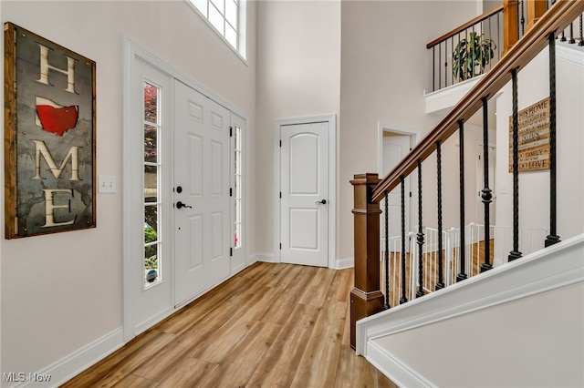 4532 Ridgestone Way, Medina, OH 44256 - entrance foyer with a high ceiling, wood finished floors, and stairs