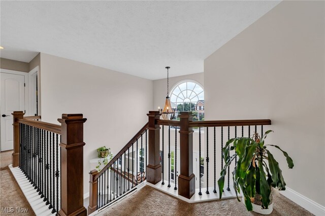 4532 Ridgestone Way, Medina, OH 44256 - stairs featuring carpet floors and a chandelier
