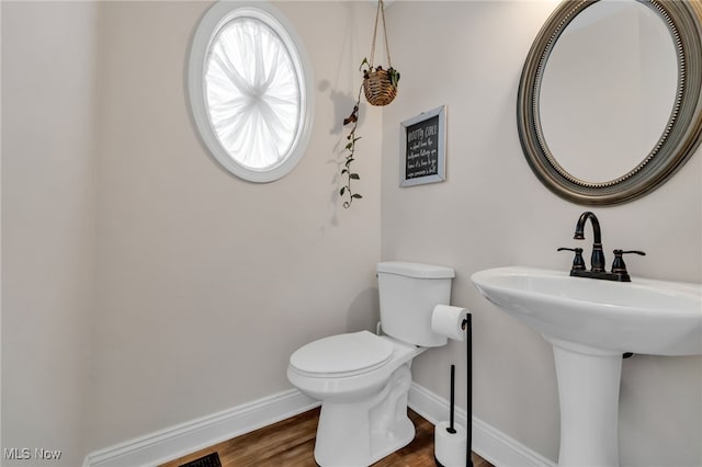 4532 Ridgestone Way, Medina, OH 44256 - half bathroom featuring baseboards and wood finished floors