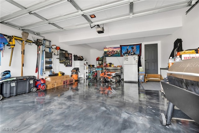 4532 Ridgestone Way, Medina, OH 44256 - garage with freestanding refrigerator, a garage door opener, and a workshop area