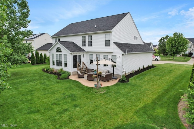 4532 Ridgestone Way, Medina, OH 44256 - back of house with outdoor lounge area, a patio, a lawn, a shingled roof, and entry steps