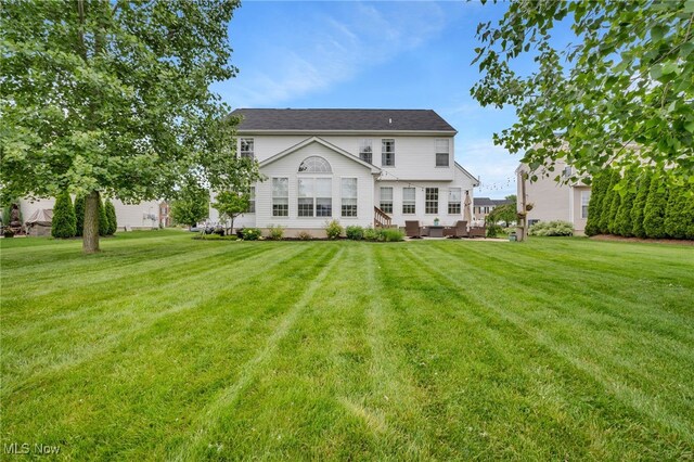 4532 Ridgestone Way, Medina, OH 44256 - rear view of house featuring a yard
