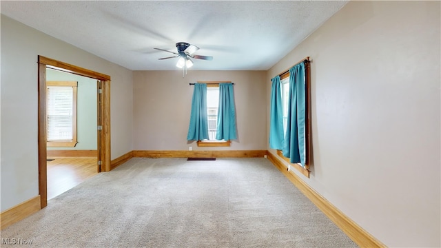 26 Walnut Ct, Mogadore, OH 44260 - carpeted empty room featuring ceiling fan and baseboards