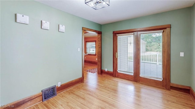 26 Walnut Ct, Mogadore, OH 44260 - unfurnished room with baseboards and light wood-style flooring