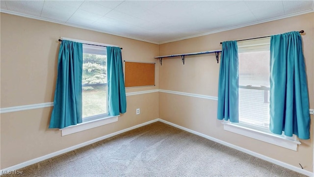 26 Walnut Ct, Mogadore, OH 44260 - carpeted empty room featuring crown molding and plenty of natural light