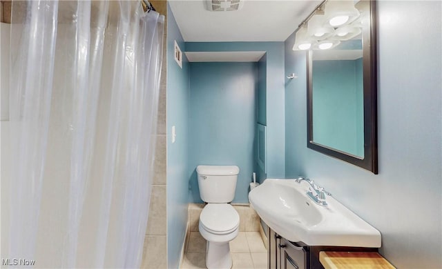 26 Walnut Ct, Mogadore, OH 44260 - full bathroom featuring vanity, tile patterned flooring, and a shower with shower curtain