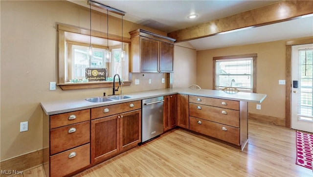 26 Walnut Ct, Mogadore, OH 44260 - kitchen with stainless steel dishwasher, a peninsula, light wood-type flooring, light countertops, and beam ceiling